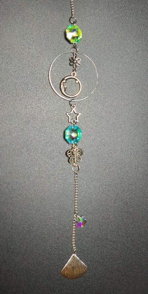 77-suncatcher-with-multiple-charms-and-crystals